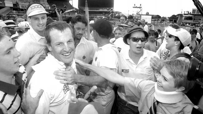 Wade Seccombe, wicket keeper and Michael Kasprowicz after Queensland’s first Sheffield Shield final win.