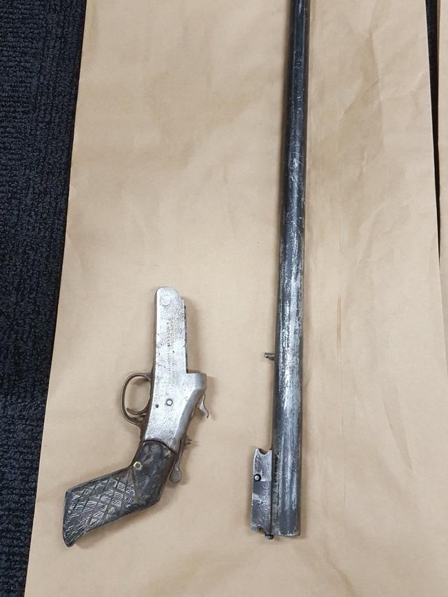 Two rifles found in Chartres-Abbott’s backyard.