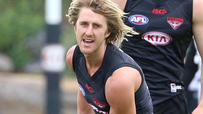 Dyson Heppell joins a handball drill. Picture: Hamish Blair