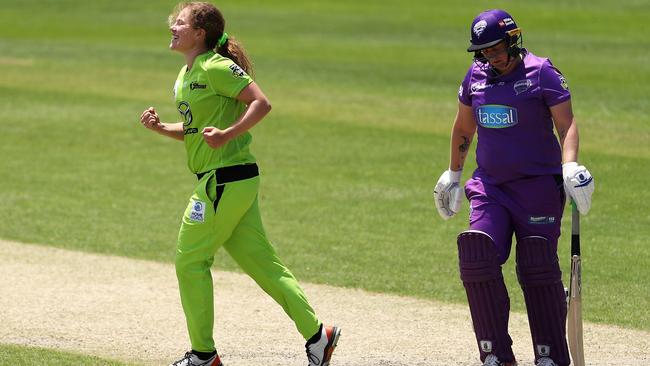 Hannah Darlington of the Thunder celebrates victory as Rachel Priest of the Hurricanes looks dejected after defeat during the Women's Big Bash League WBBL match between the Hobart Hurricanes and the Sydney Thunder at Hurstville Oval, on November 08, 2020, in Sydney, Australia. (Photo by Mark Kolbe/Getty Images)