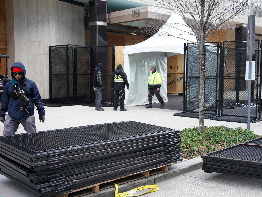 Workers are seen stacking security fencing near the White House in Washington, DC on January 18. Picture: Mandel Ngan / AFP