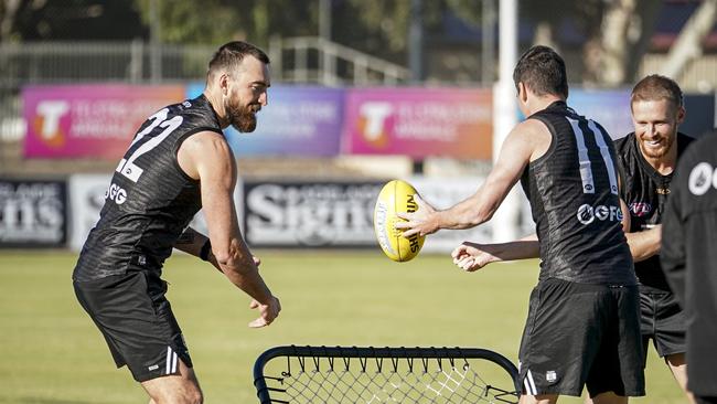 Charlie Dixon and Tom Rockliff during the captain’s run. Picture: Mike Burton.