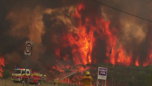 Flames are seen engulfing bushland on Arizona Rd, Charmhaven, NSW, 2263DCC. Picture: TNV