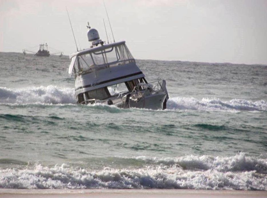 ISLAND EMERGENCY: A luxury Riviera cruiser has been run aground on Fraser Island after taking water overnight. Picture: Contributed