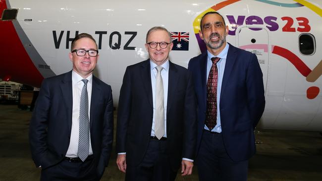 Qantas’s former CEO Alan Joyce together with Prime Minister Anthony Albanese and former AFL footballer Adam Goodes at the launch of the Qantas Yes Campaign in Sydney. Picture: Gaye Gerard / NCA Newswire