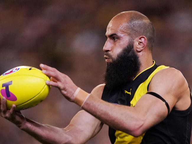 Bachar Houli of the Tigers gathers the ball during the First Preliminary Final match between the Richmond Tigers and the Geelong Cats in Week 3 of the AFL Finals Series at the MCG in Melbourne, Friday, September 20, 2019. (AAP Image/Michael Dodge) NO ARCHIVING, EDITORIAL USE ONLY