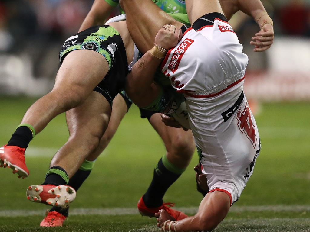 WOLLONGONG, AUSTRALIA - JULY 14: Timoteo Lafai of the Dragons Is tackled by Nick Cotric of the Raiders during the round 17 NRL match between the St George Illawarra Dragons and the Canberra Raiders at WIN Stadium on July 14, 2019 in Wollongong, Australia. (Photo by Mark Metcalfe/Getty Images)