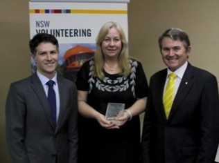 VOLLIE OF THE YEAR: Susan Biggar with NSW Minister for Citizenship and Communities Victor Dominello (left) and Ballina MP Don Page. . Picture: Contributed