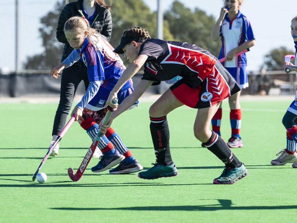 Makaylah Hawken (left) of Rangeville and Caesia Johnson of Past High in under-11 girls Presidents Cup hockey at Clyde Park, Saturday, May 27, 2023. Picture: Kevin Farmer