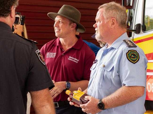 Acting Premier Steven Miles (centre) and Inspector Bruce Thompson (right).