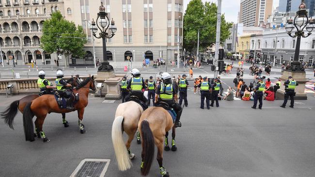 Police on guard outside state Parliament. Picture: Jason Edwards