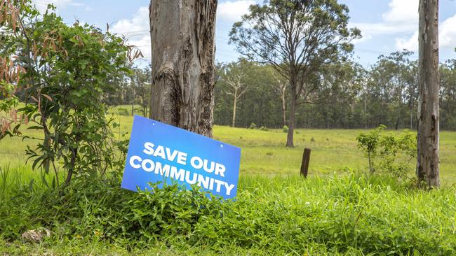 A sign on Warner Road in November, 2017. The community is concerned about plans to clear koala habitat in the area. (AAP/Richard Walker)