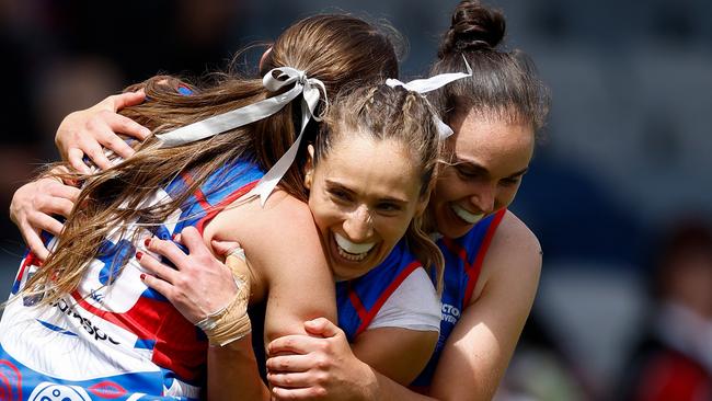 BALLARAT, AUSTRALIA - OCTOBER 27: (L-R) Sarah Hartwig, Dominique Carruthers and Naomi Ferres of the Bulldogs celebrate during the 2024 AFLW Round 09 match between the Western Bulldogs and Euro-Yroke (the St Kilda Saints) at Mars Stadium on October 27, 2024 in Ballarat, Australia. (Photo by Michael Willson/AFL Photos via Getty Images)