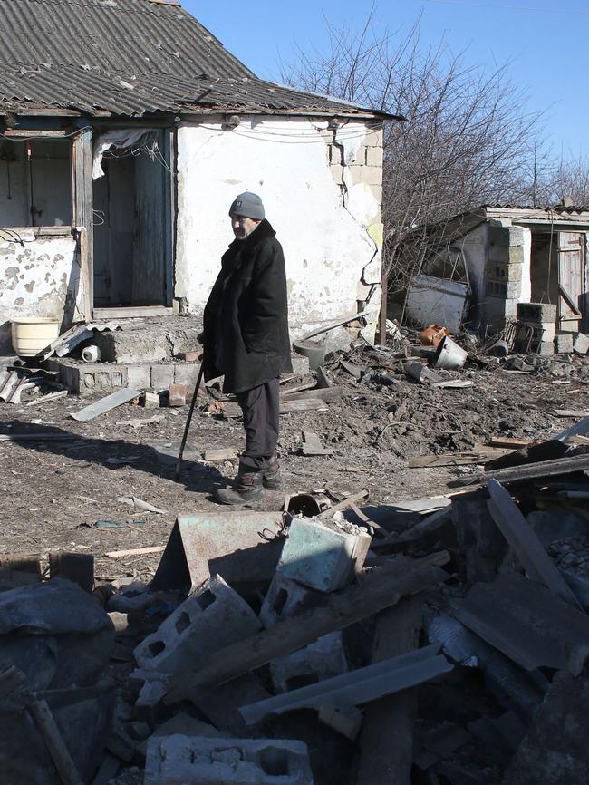 A local resident inspects his house, damaged after a shelling in Novohnativka village, Donetsk region. Picture: AFP