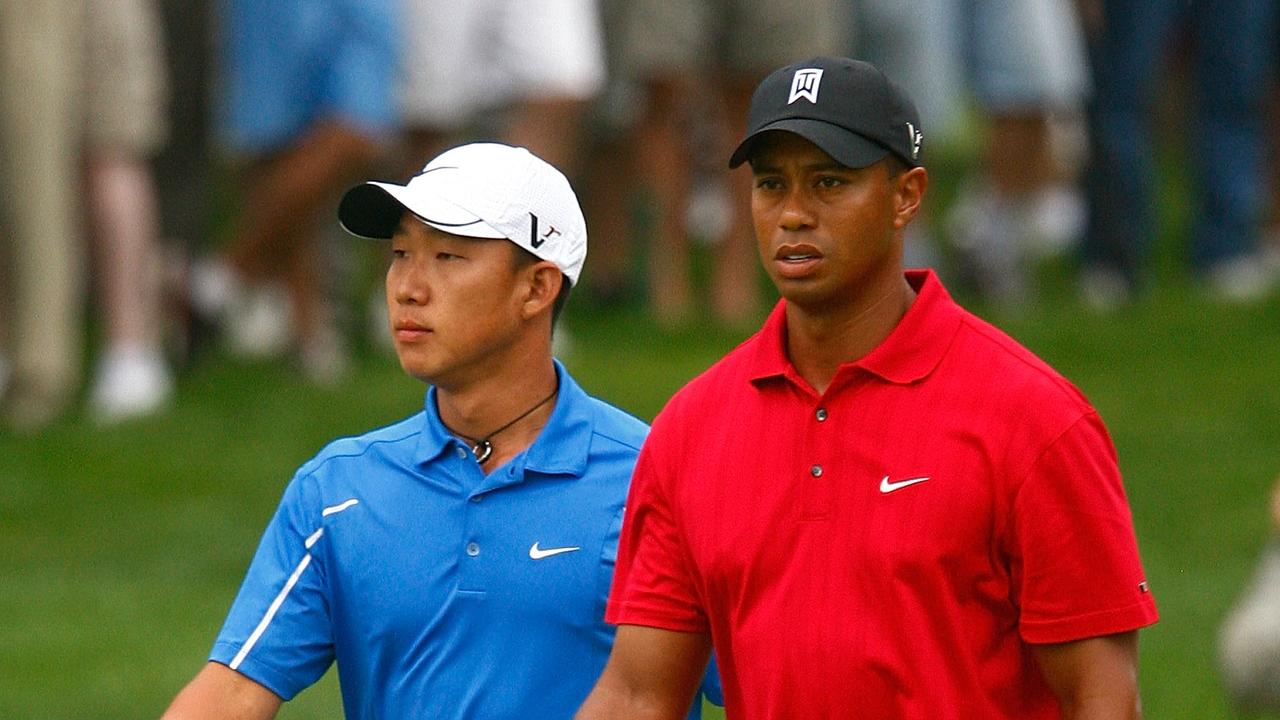 BETHESDA, MD - JULY 05: Tiger Woods walks with Anthony Kim in the 16th fairway during the final round of the AT&amp;T National at the Congressional Country Club on July 5, 2009 in Bethesda, Maryland. (Photo by Scott Halleran/Getty Images)