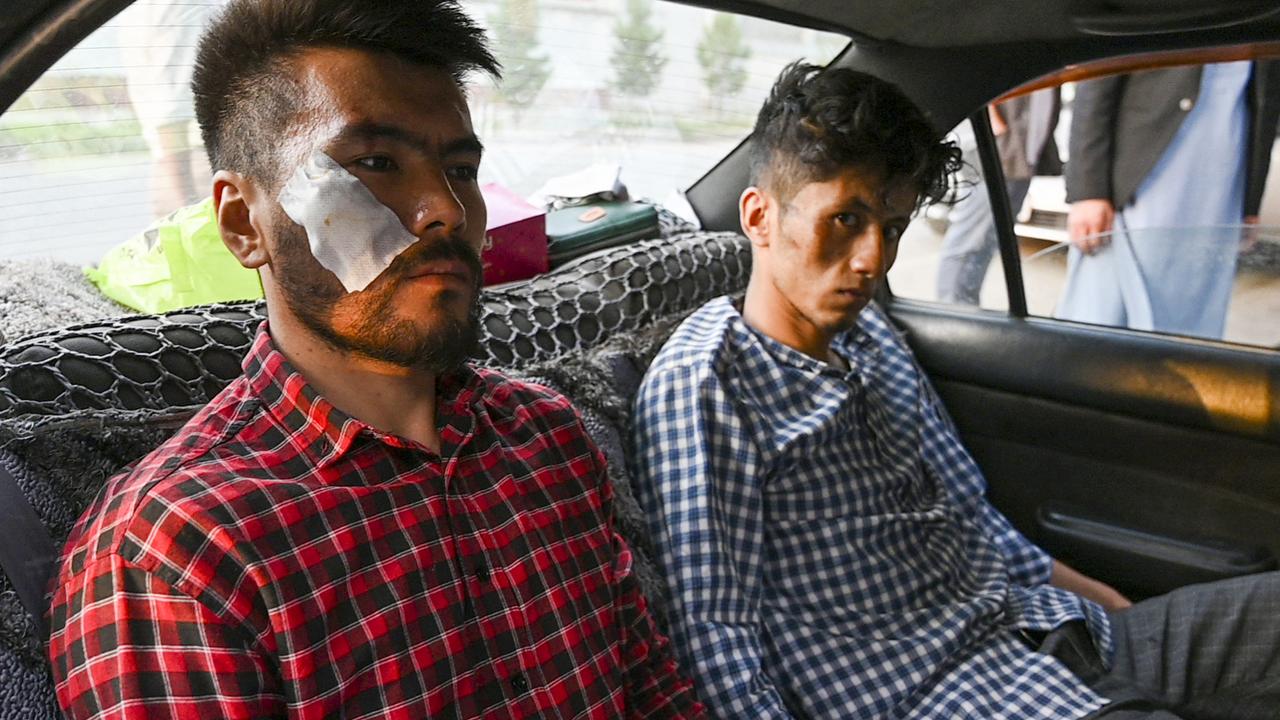 Nematullah Naqdi and Taqi Daryabi were beaten by the Taliban after covering a protest in the capital Kabul. Picture: Wakil Kohsar/AFP