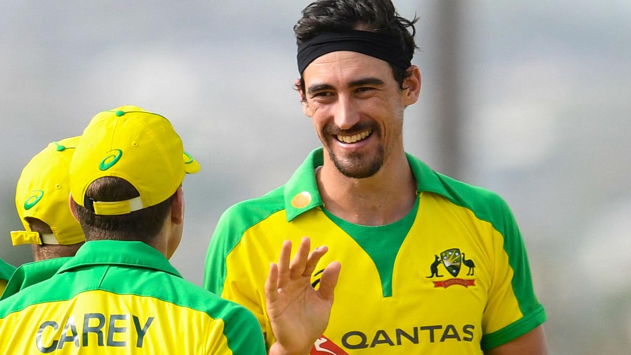 Mitchell Starc (R) of Australia celebrates the dismissal of Kieron Pollard of West Indies during the 3rd and final ODI between West Indies and Australia at Kensington Oval, Bridgetown, Barbados, on July 26, 2021. (Photo by Randy Brooks / AFP)