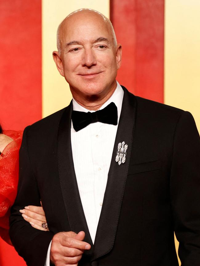 Billionaire Jeff Bezos is loud and proud with a shiny pate. Picture: AFP