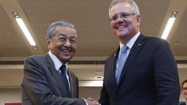 Malaysian Prime Minister Mahathir Mohamad and Scott Morrison in Singapore yesterday. Picture: EPA