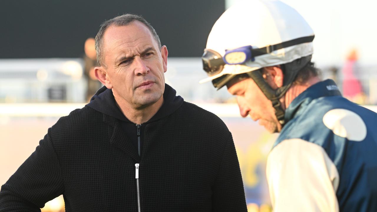 Steven Arnold chats with Chris Waller after riding Buckaroo in a Caulfield gallop. Picture: Vince Caligiuri/Getty Images