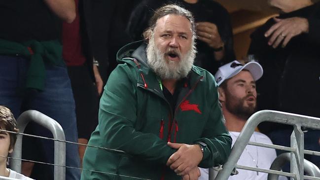 Russell Crowe, with fellow actor Chris Hemsworth, watches his beloved Rabbitohs.