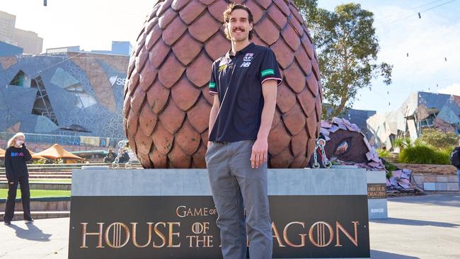 Max King with giant dragon egg at Federation Square ahead of House of Dragons launch Picture: Aaron Walker