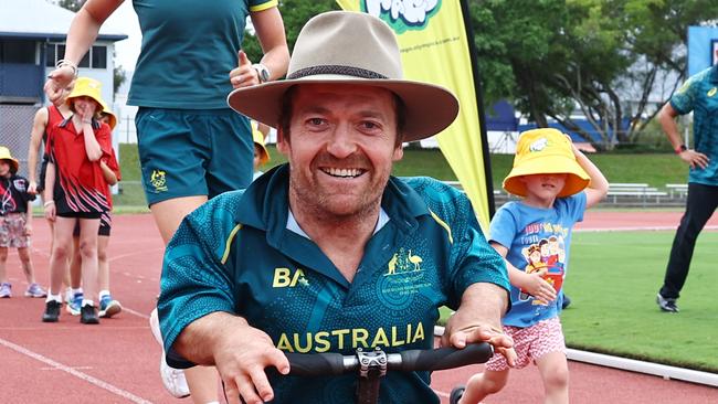 The Brisbane Organising Committee for the 2032 Olympic and Paralympic Games have visited Barlow Park to inspire the next generation of Far North Queensland athletes. Cairns paralympian Grant "Scooter" Patterson and Olympic sprinter Ellie Beer compete in a mini sprint race with Elliot Lamond, 3. Picture: Brendan Radke