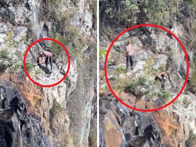 Distressing scenese have been captured of hikers perched atop a cliff just centimetres from falling hundreds of metres.