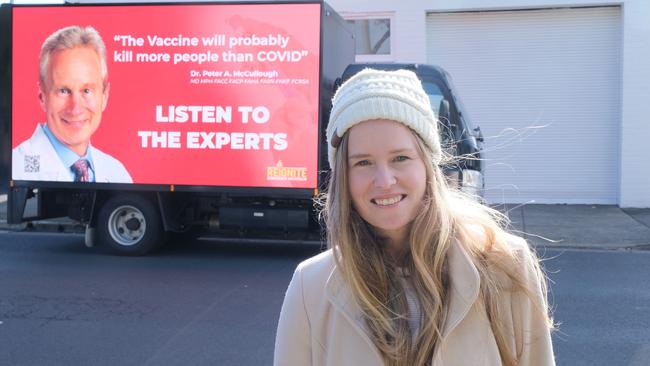 Monica Smit in front of one of her anti-vax billboards in Geelong. Picture: Mark Wilson