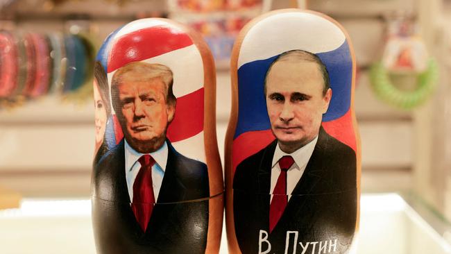 Traditional Russian Matryoshka dolls, depicting Russia's President Vladimir Putin, right,, US President Donald Trump and his wife Melania, left, are displayed for sale at a gift shop in downtown Moscow. Picture: AFP