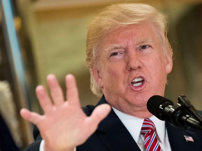 NEW YORK, NY - AUGUST 15: US President Donald Trump speaks following a meeting on infrastructure at Trump Tower, August 15, 2017 in New York City. He fielded questions from reporters about his comments on the events in Charlottesville, Virginia and white supremacists.   Drew Angerer/Getty Images/AFP == FOR NEWSPAPERS, INTERNET, TELCOS & TELEVISION USE ONLY ==