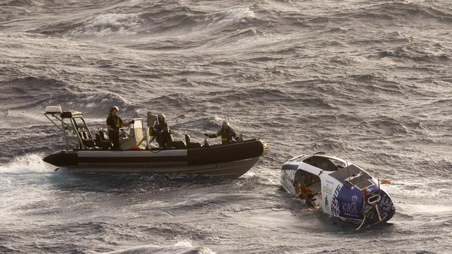 The moment rower Aurimas Mockus is rescued off the coast of Australia after being caught in turbulent seas from Tropical Cyclone Alfred. Picture: Supplied / AMSA