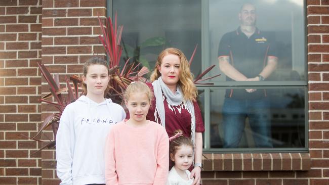 FIFO worker James with wife Jarrah and their children Harper, 11, Olivia, 9, and Quinn, 4, outside. Picture: PATRICK GEE