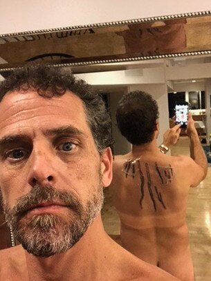 Selfies of the fresh Finger Lakes tattoos on Hunter's back, still under cling wrap, taken in a bathroom in Malibu, in September 2018.