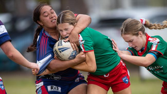 Corrimal’s Ashley Swan-Hayles is tackled by Collegians Tetuanui Dean. News Local, Pictures by Julian Andrews.