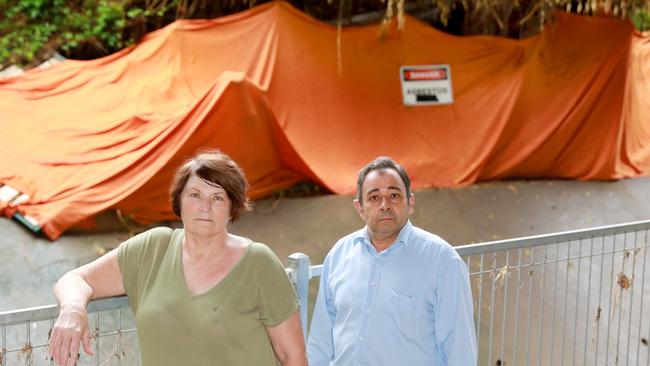 Deeply frustrated Granville residents Kerrie Poyner and Sam Mitry on the banks of A’Becketts Creek, where a stockpile of asbestos is still waiting to be removed and the site properly remediated. Picture: AAP IMAGE/ Angelo Velardo