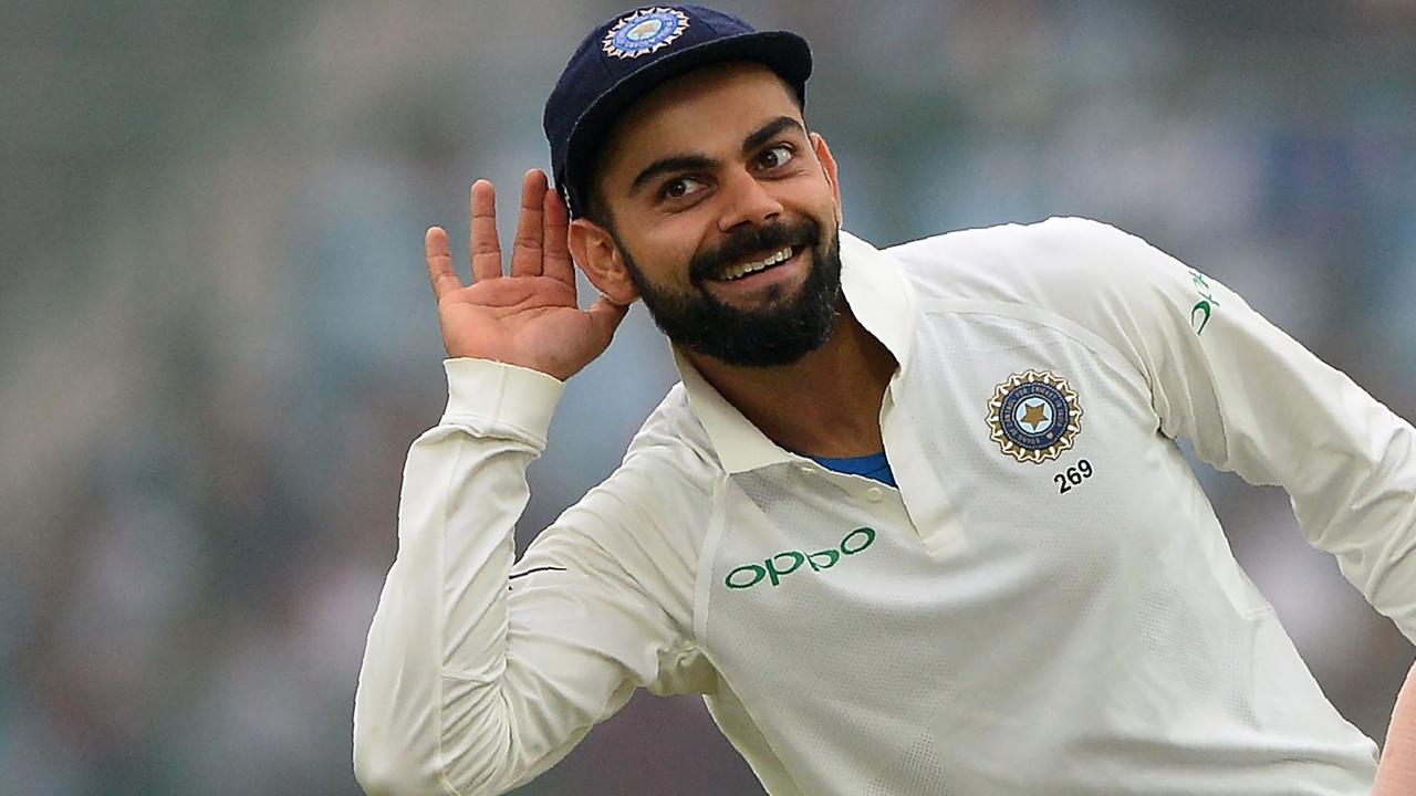 (FILES) This file photo taken on December 5, 2017 shows Indian team captain Virat Kohli (L) gesturing towards the crowd as teammate Shikhar Dhawan looks on during the fourth day of third Test cricket match between India and Sri Lanka at the Feroz Shah Kotla Cricket Stadium in New Delhi. Man of the series Virat Kohli plundered runs and records in all three matches. Nicknamed King Kohli, the prolific batsman is in the form of his life, hitting two double centuries in the series including a career-best 243 in Delhi. / AFP PHOTO / SAJJAD HUSSAIN / ----IMAGE RESTRICTED TO EDITORIAL USE - STRICTLY NO COMMERCIAL USE----- / GETTYOUT