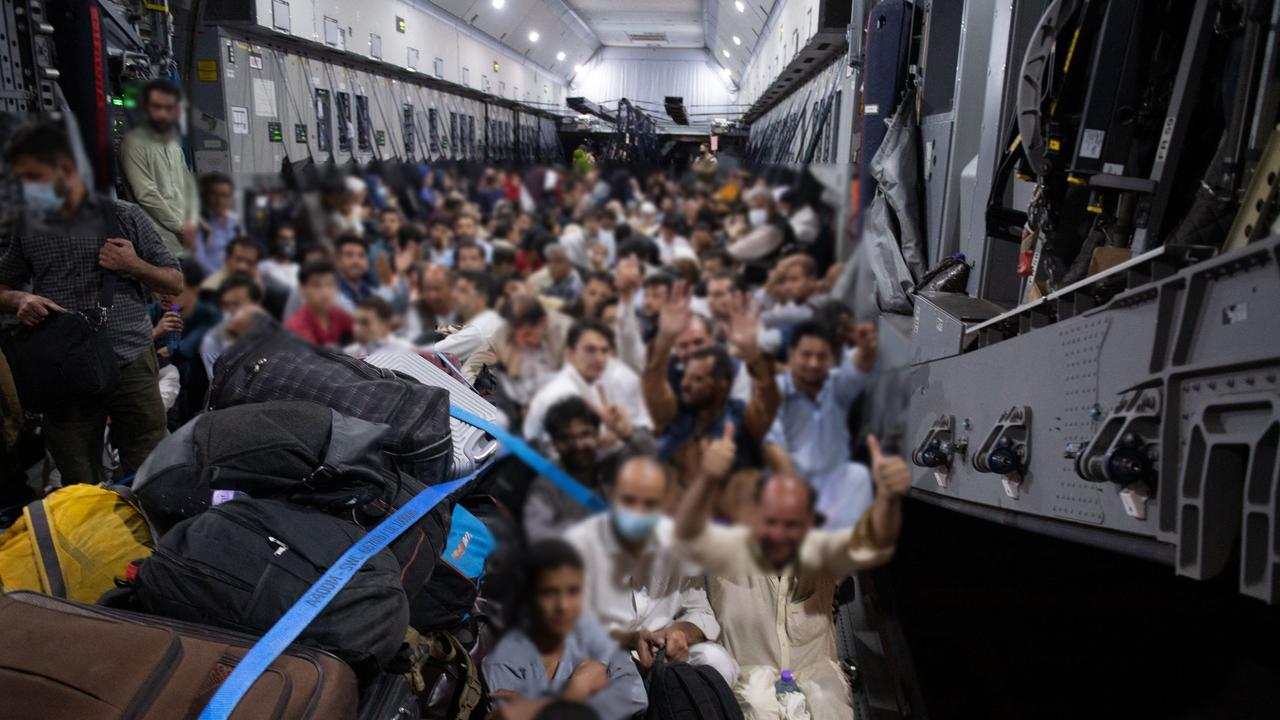 People boarding a French military transport aircraft at the airport in Kabul, to fly to the air base of Al Dhafra, near Abu Dhabi, and then to Roissy Charles-de-Gaulle airport, north of Paris. Picture: AFP