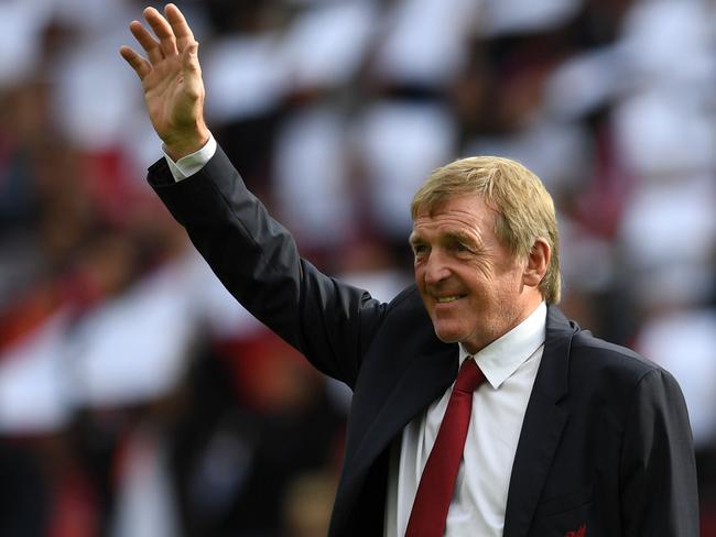 (FILES) In this file photo Former Liverpool player and manager Kenny Dalglish takes the applause of the supporters a day after having the new grandstand named after him, on the pitch ahead of the English Premier League football match between Liverpool and Manchester United at Anfield in Liverpool, north west England on October 14, 2017. - Liverpool legend Kenny Dalglish has tested positive for coronavirus but is not showing symptoms of the disease, his family said Friday. (Photo by Paul ELLIS / AFP) / RESTRICTED TO EDITORIAL USE. No use with unauthorized audio, video, data, fixture lists, club/league logos or 'live' services. Online in-match use limited to 75 images, no video emulation. No use in betting, games or single club/league/player publications. /