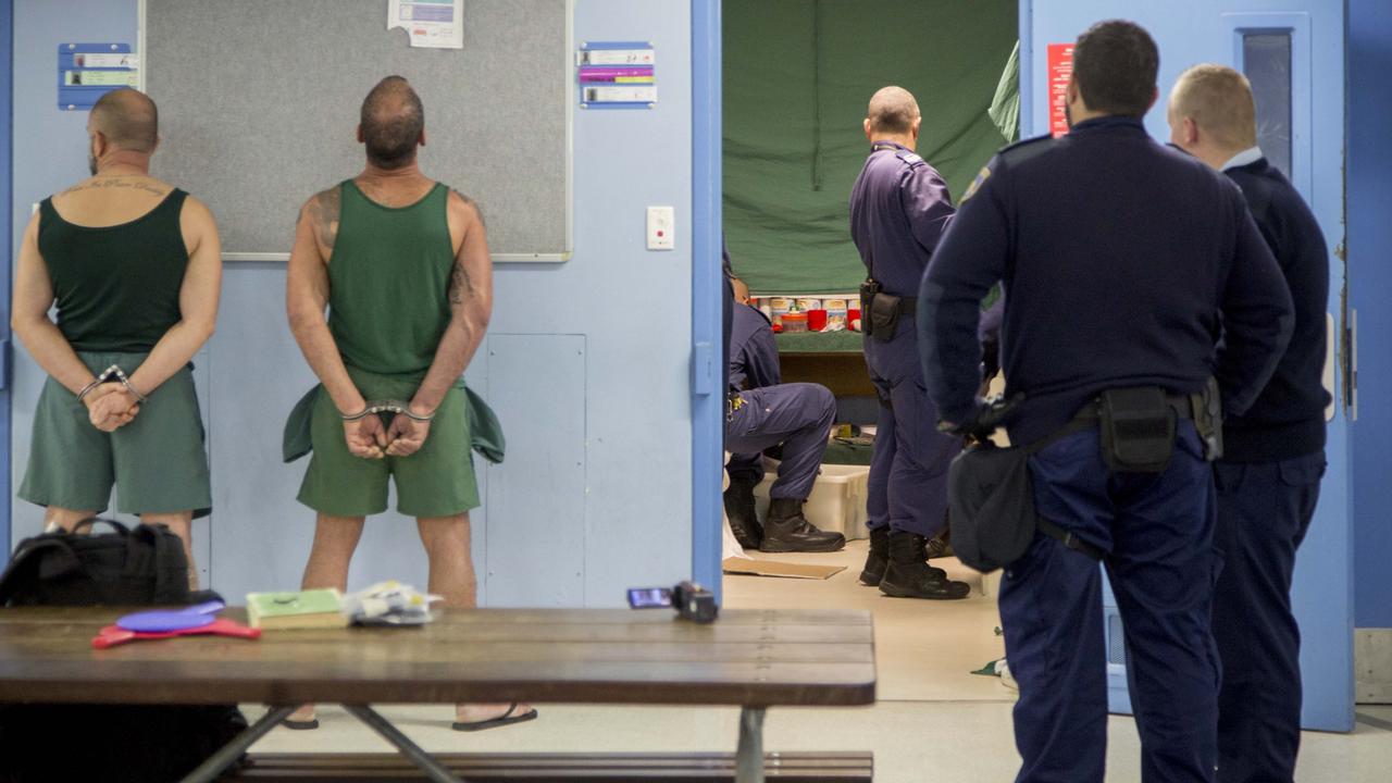 Prisoners cuffed outside a cell as officers search Parklea after an incident involving a knife. Picture: CSNSW.