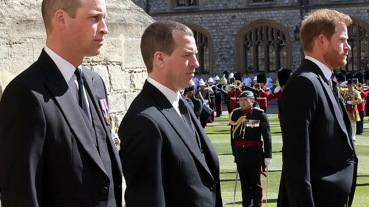 Prince William, left, and Harry, right, walk with cousin Peter Phillips in a procession behind the Duke of Edinburgh’s coffin at his funeral in Windsor on April 17. Picture: Chris Jackson/WPA Pool/Getty Images)