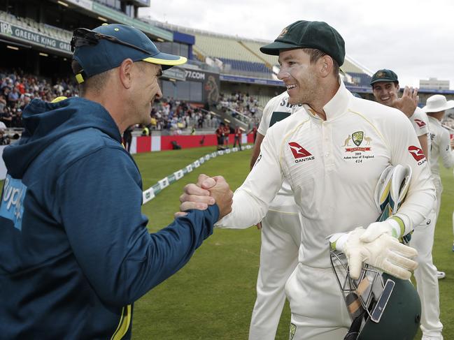 Justin Langer celebrates with Tim Paine after the first Ashes Test. Picture: Ryan Pierse/Getty Images