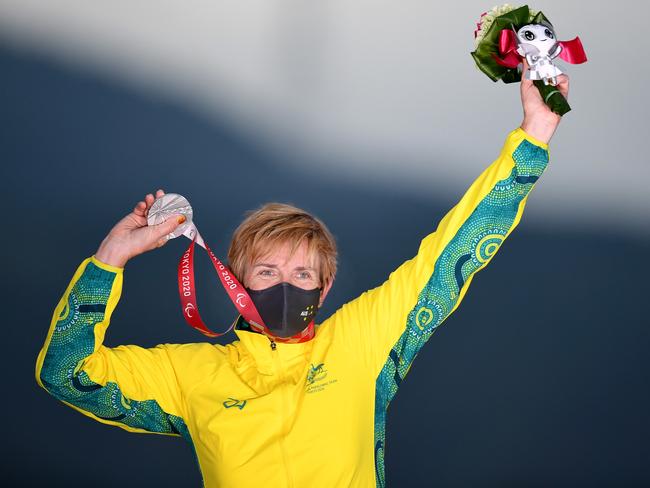 Carol Cooke shows off the spoils of her efforts on the road. Picture: Paralympics Australia