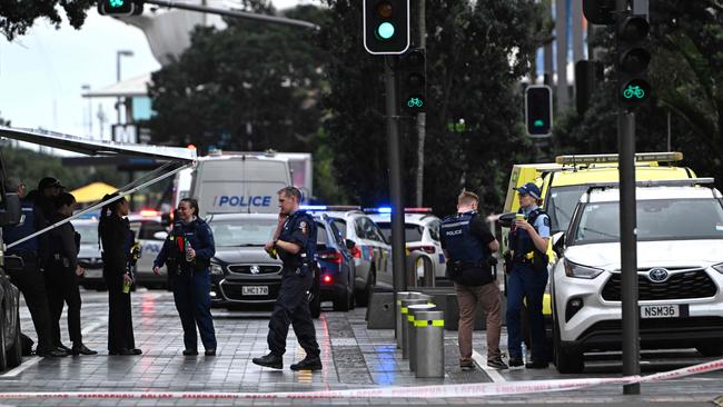 Police officers cordon off the site of a shooting in central Auckland. Picture: Saeed Khan / AFP