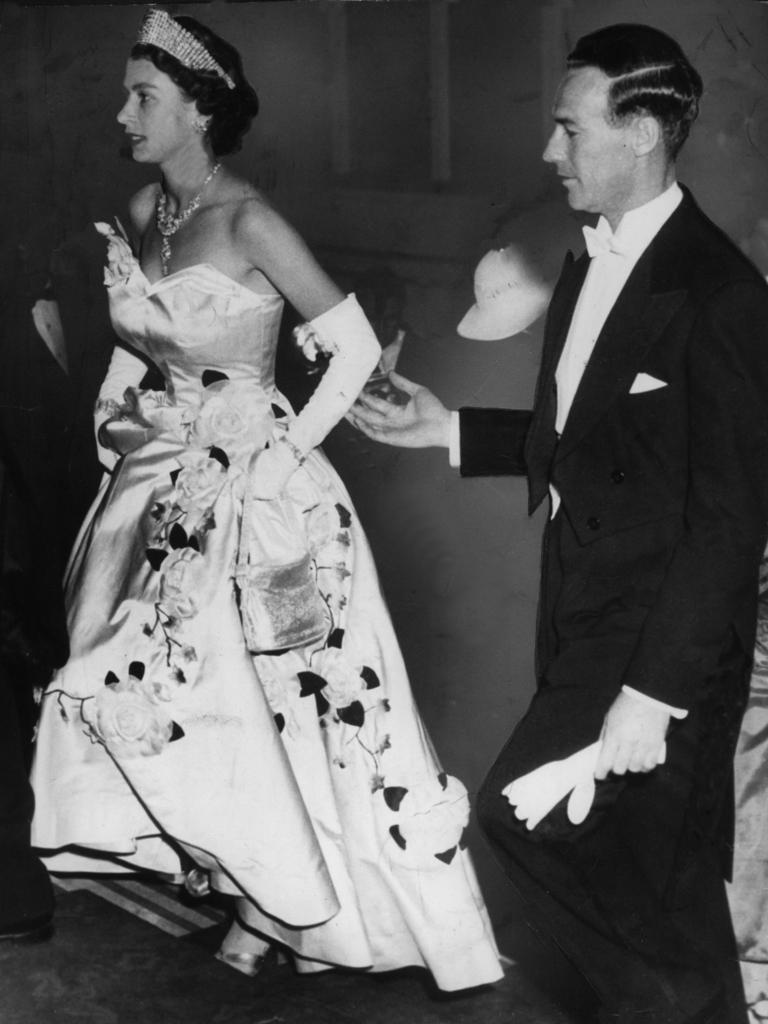 1954: Lord Mayor of Sydney Pat Hills lightly touches Queen Elizabeth II elbow (a breach of etiquette) as he escorts her up the steps of the Town Hall in Sydney for the Lord Mayor's Ball in 1954. Picture: News Ltd.