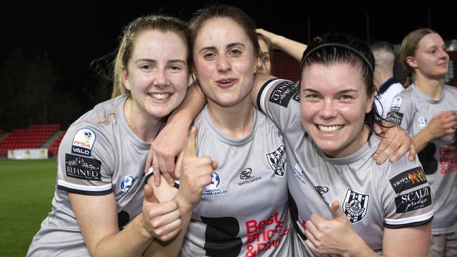 WNPL SA coach’s award winner Dylan Holmes (left) celebrates Adelaide City’s grand final win with teammates Georgia Campagnale and Bianca Gray. Picture: AAP/Emma Brasier