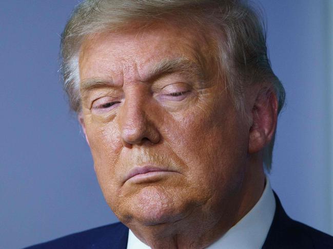 TOPSHOT - US President Donald Trump looks down during an event on lowering prescription drug prices in the Brady Briefing Room of the White House in Washington, DC on November 20, 2020. (Photo by MANDEL NGAN / AFP)