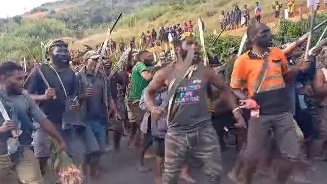 Tribal fighters in Papua New Guinea’s Enga Province face off in a show of their strength, with many brandishing home-made guns and metre-long bush knives that leave victims with devastating wounds. Picture: Facebook