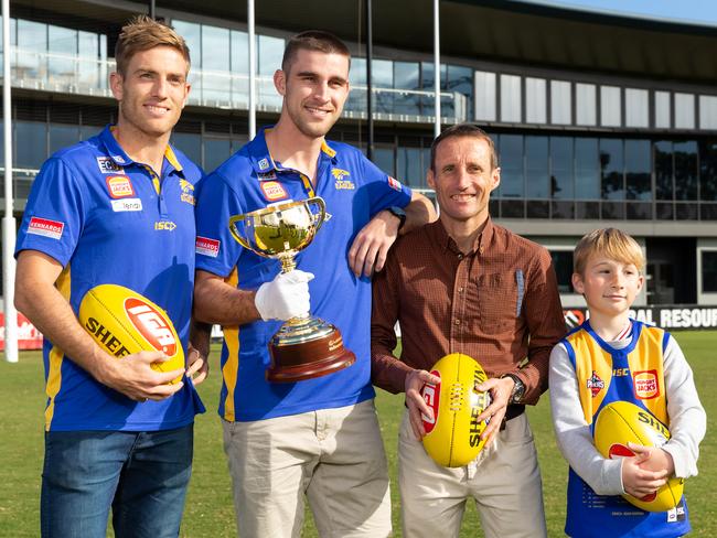 West Coast Eagles players Brad Sheppard and Elliot Yeo with the Melbourne Cup, Damien Oliver and son Luke in Perth. Picture: Paul Kane