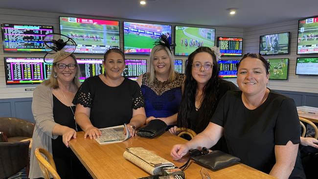 Melbourne Cup in Port Macquarie: Sheryl Turner, Jacinda Booby, Bec Herden, Grace Duggan and Bree Moller celebrating at Settlers Inn Hotel.